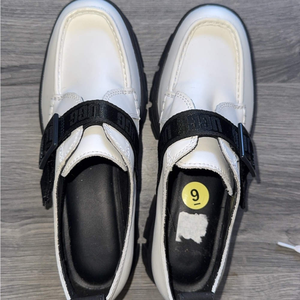 Chic White Loafers with Black Strap